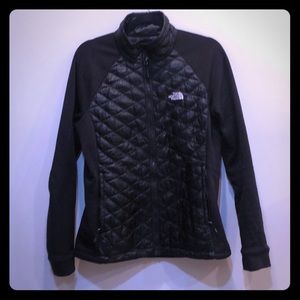Black North Face zip up, puff and stretch material